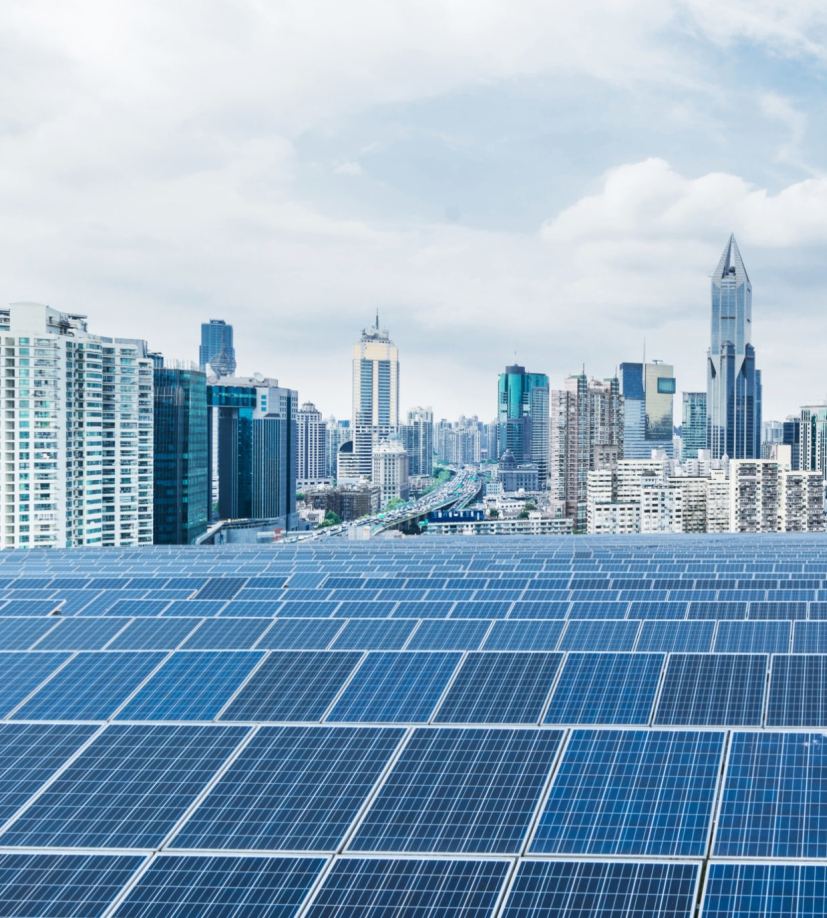 Solar panels installed in a field, representing distributed EV charging power sources